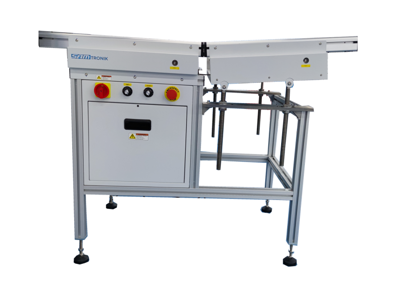 PCB solder infeed conveyor loading boards into a wave soldering machine