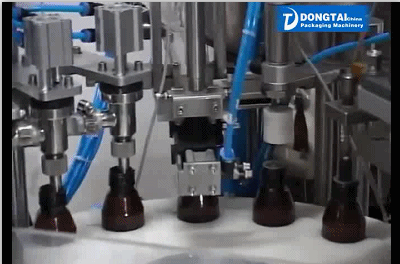 Automatic small glass bottle liquid filling capping and labeling machine