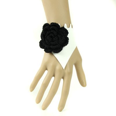 Graceful white wristband with black woolen flower