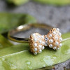 [Free Shipping]M40239 Korean jewelry the golden pearl inlaid bow compact Ring Ring 2g