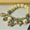 [Free Shipping]CR-784 retro brand luxury pearl crown beauty head keylock hollow peach heart stretch bracelet