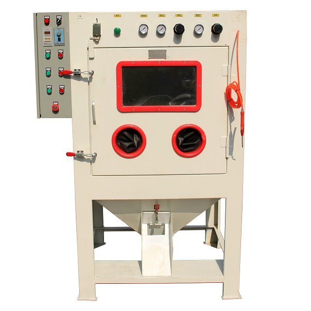 Turnble blast machine