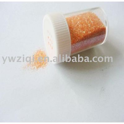 Iridescence orange color glitter powder in vessel