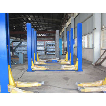 Symmetric two post hydraulic vehicle lift with base frame