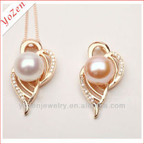 Natural near round pearl pendant three color wing shape
