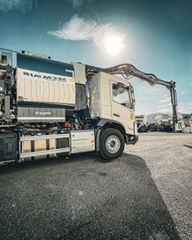Secmair chipsealer equipment on road construction site
