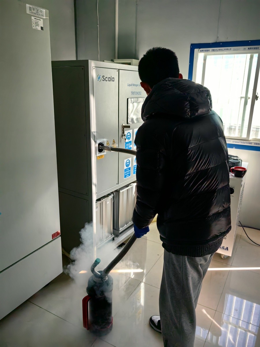 A student is dispensing liquid nitrogen from liquid nitrogen generator