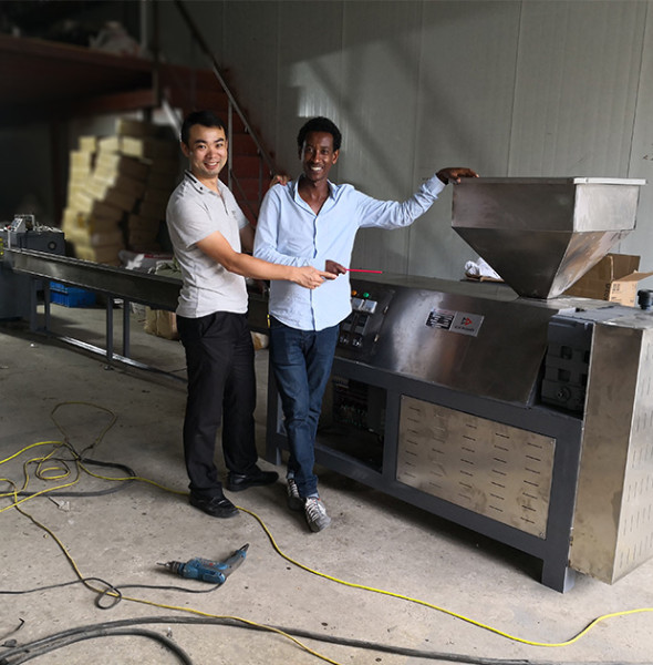 customer come again to our factory to check the trial running of his eraser production line.