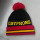 knitted pattern beanie hat with pompoms