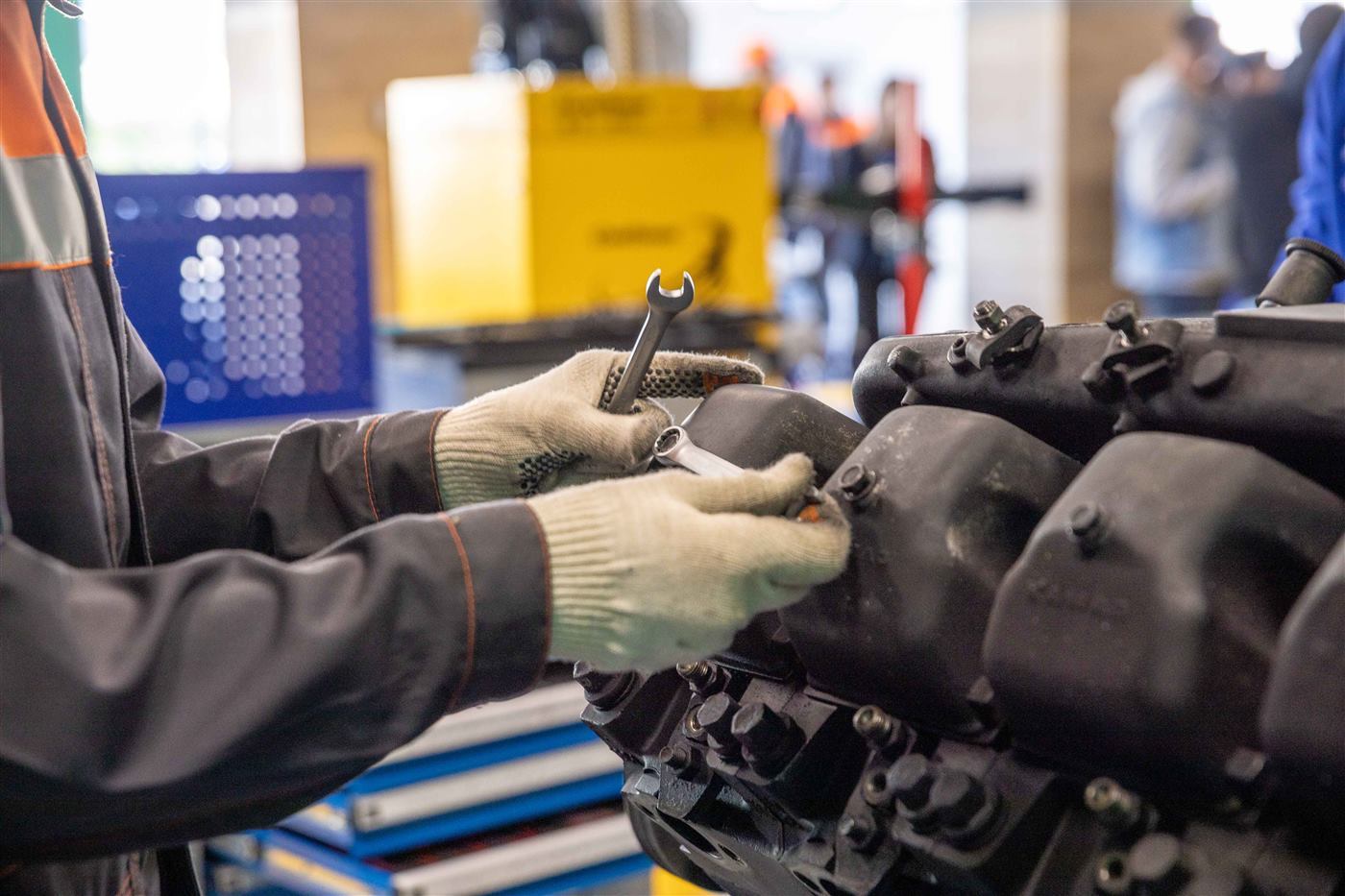Technician performing mechanical maintenance