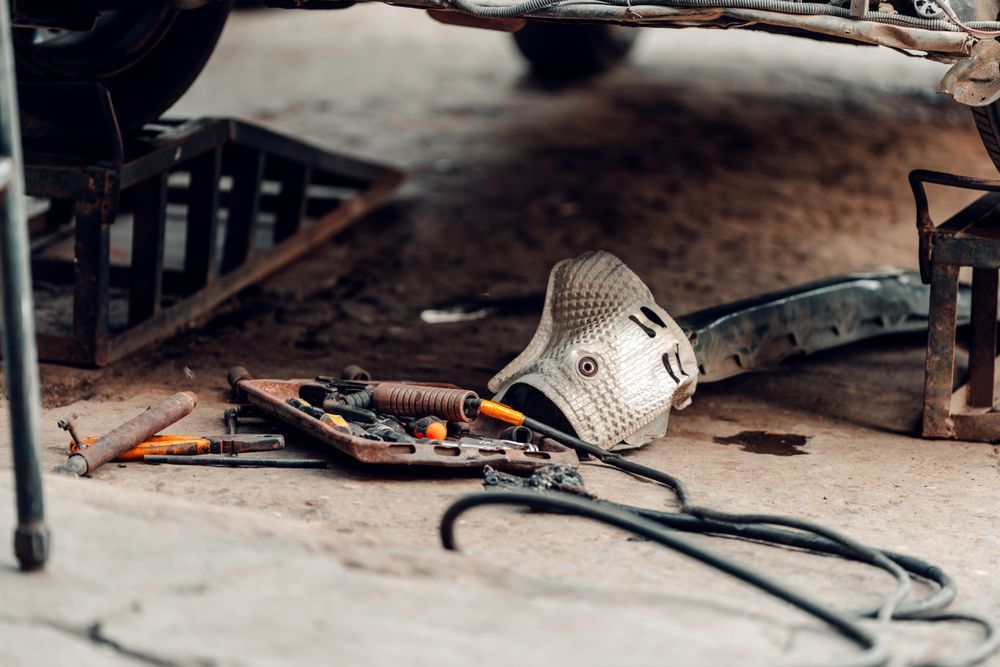 Organized workshop tools near a vehicle service bay