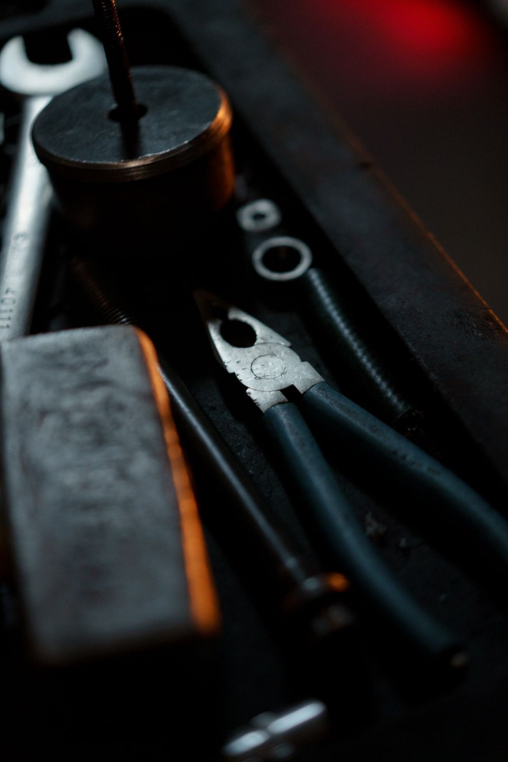 Close-up of unbranded hand tools used for careful mechanical work