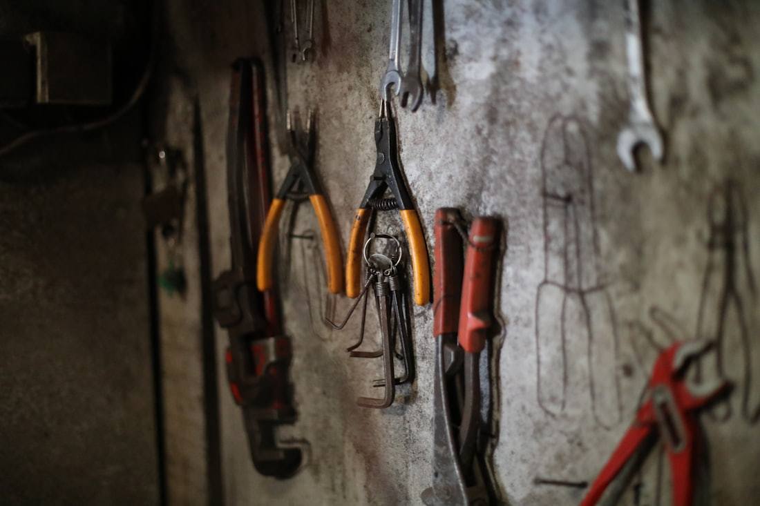 Unbranded hand tools arranged for workshop maintenance