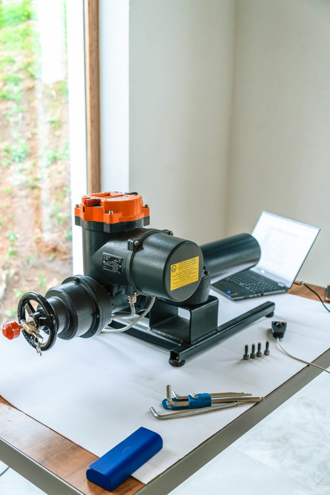 Unbranded mechanical equipment on a clean workshop bench