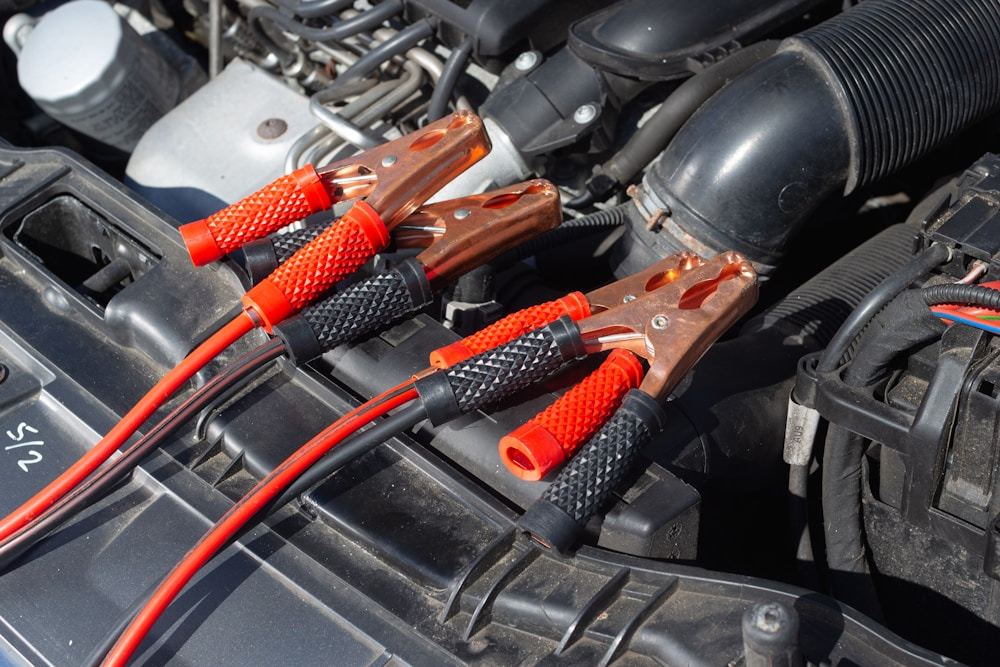 Service area showing a vehicle engine bay and working components