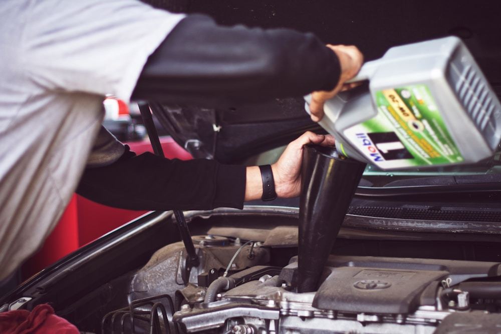 Technician inspecting mechanical parts during repair