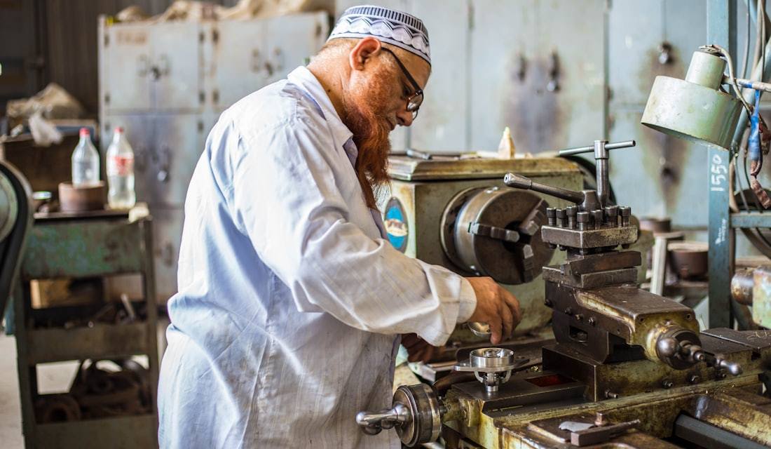 Worker inspecting mechanical equipment
