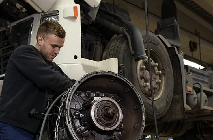 Heavy workshop scene with truck service equipment