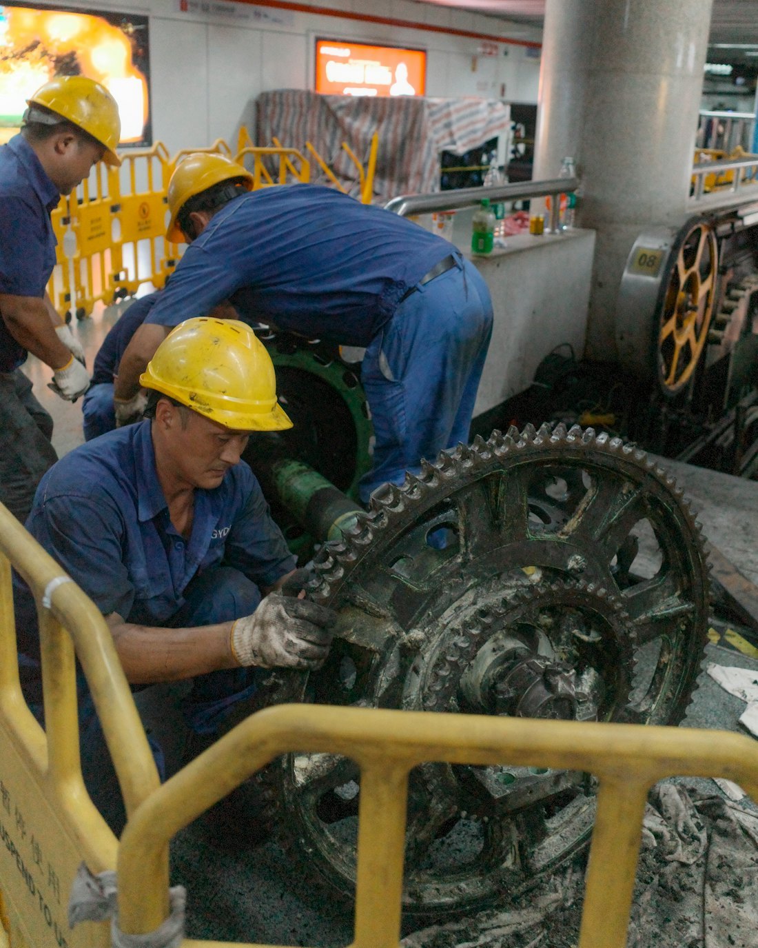 Maintenance team working on large industrial gears
