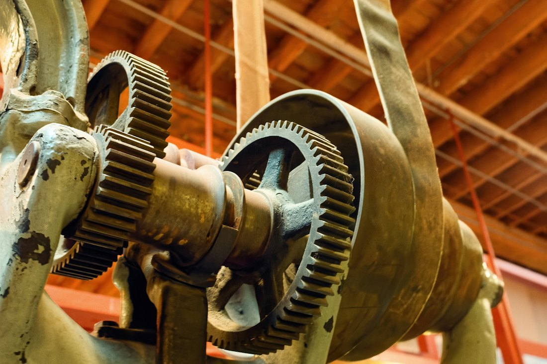 Industrial machinery gears in a workshop