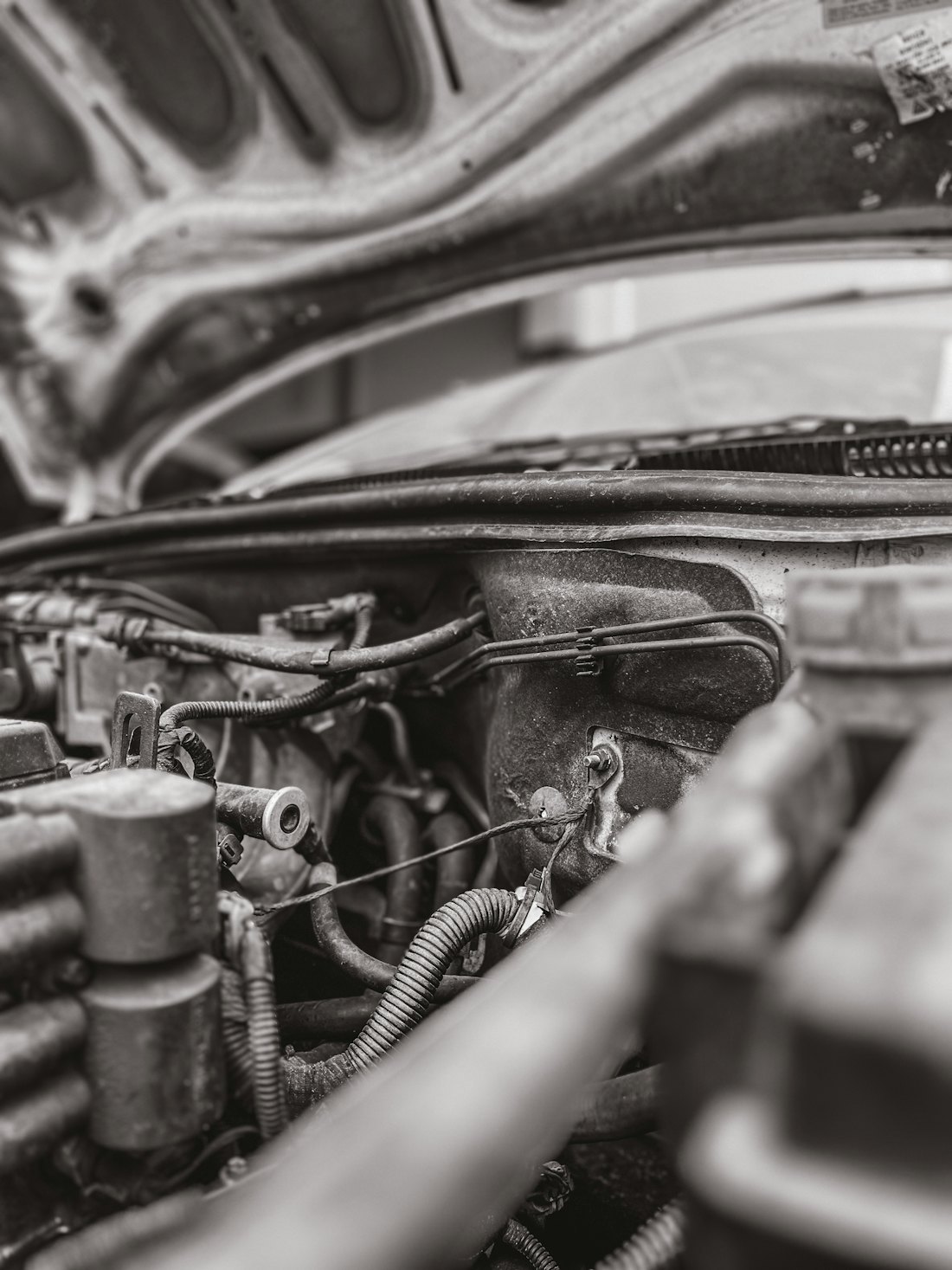 Automotive engine bay showing confined service access