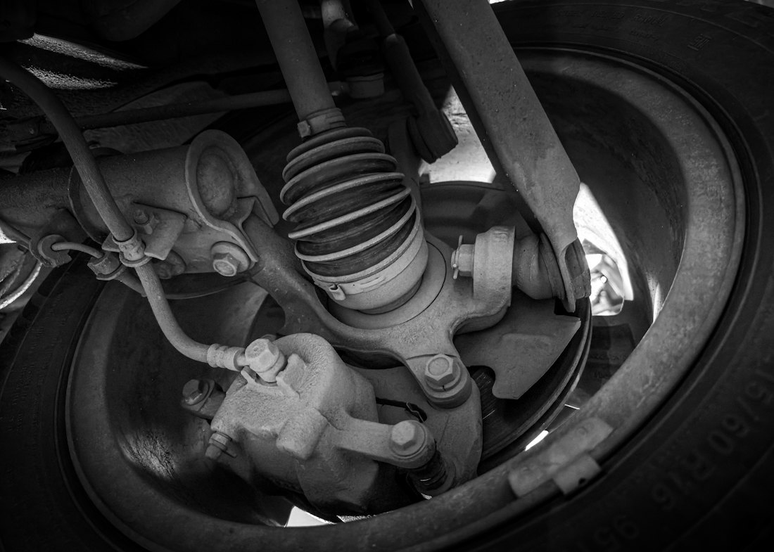 Close view of an automotive suspension assembly in a workshop