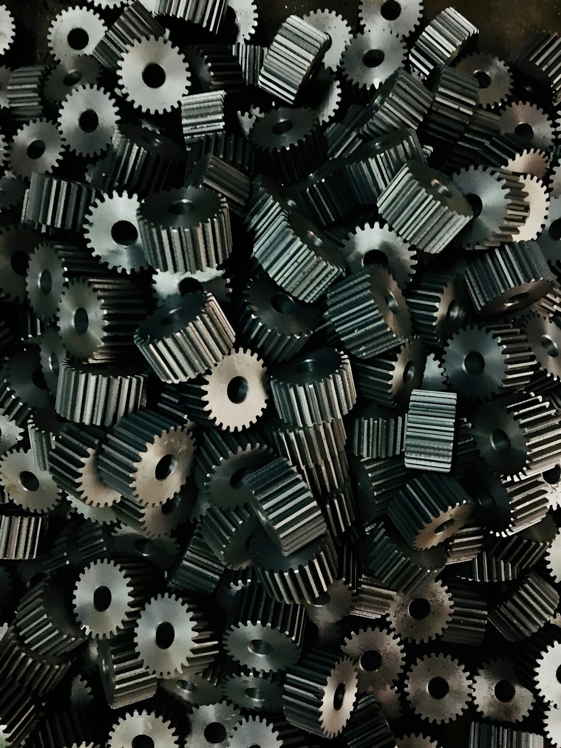 Intermeshing metal gears that illustrate tight-clearance removal work