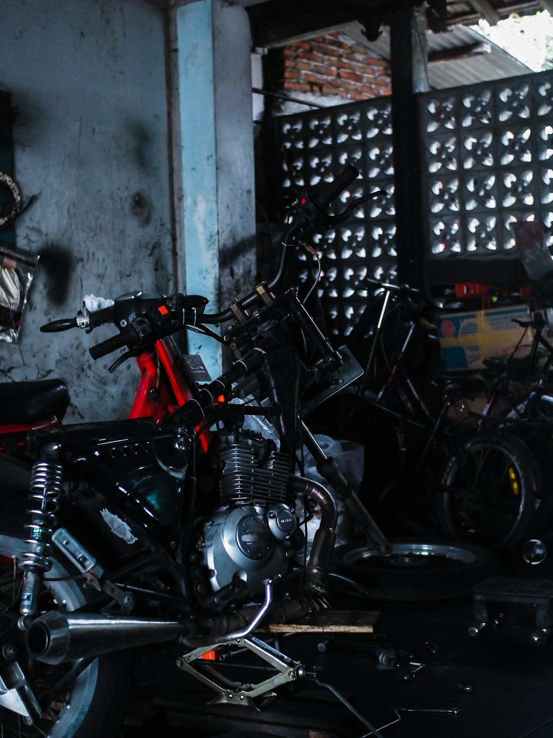 Motorcycle workshop setting where compact internal bearing access is common