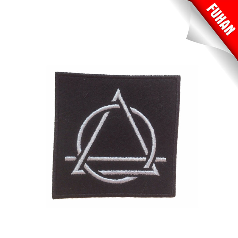 Laser cut woven patch with adhesive back