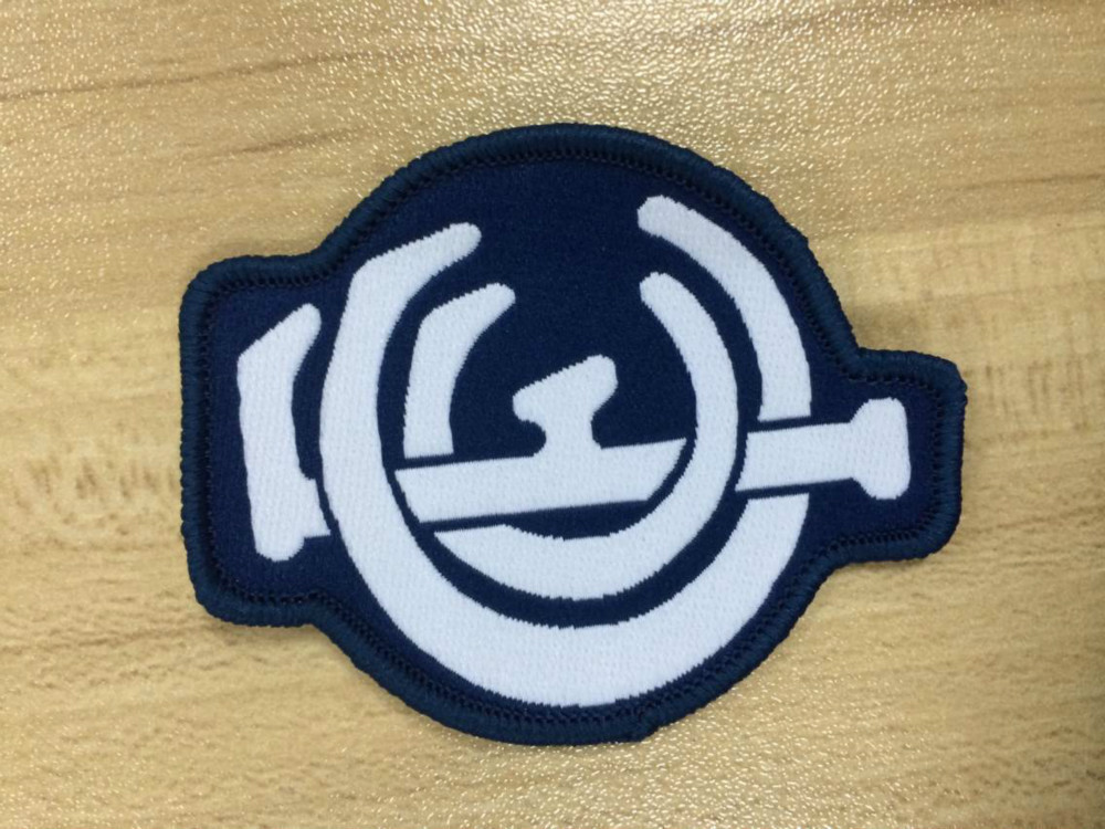 Exquisite Merrowed Border irregular shape woven patch with animal logo for clothing