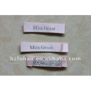 pink woven label and golden letter for garment