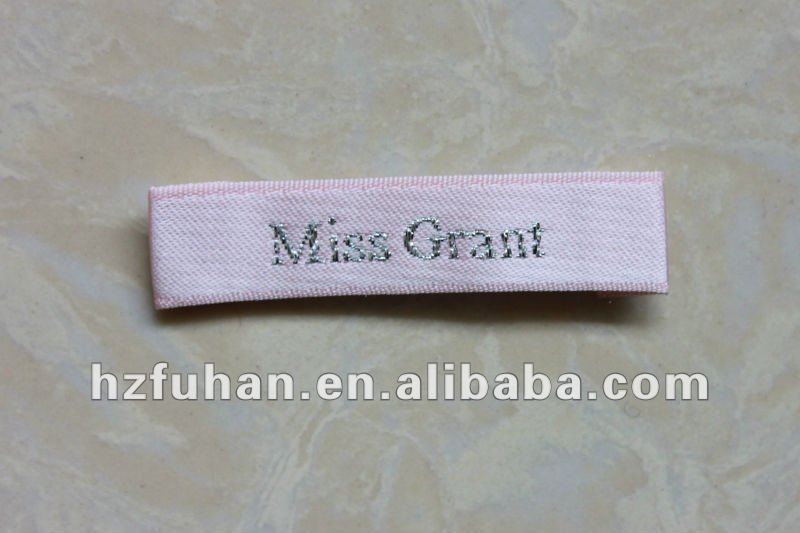 pink woven label and golden letter for garment