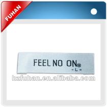 white botton and black letters clothing tags and woven labels