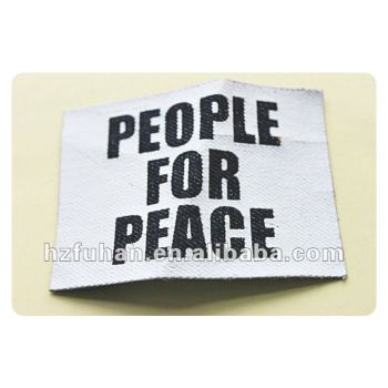 white printed label with the letter people for peace