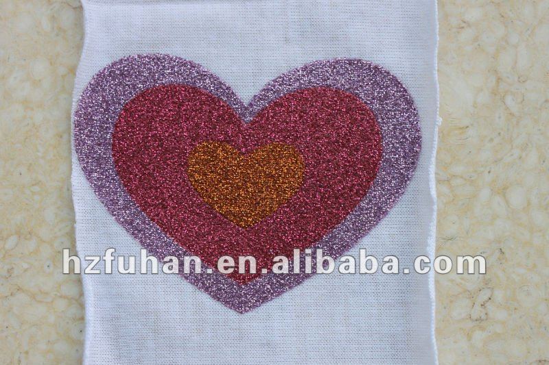 white cotton printed care label with colourful heart