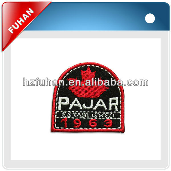 Shoulder woven patch in apparel with embroidery edge