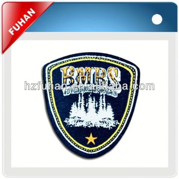custom embossed woven patch with adhesive back