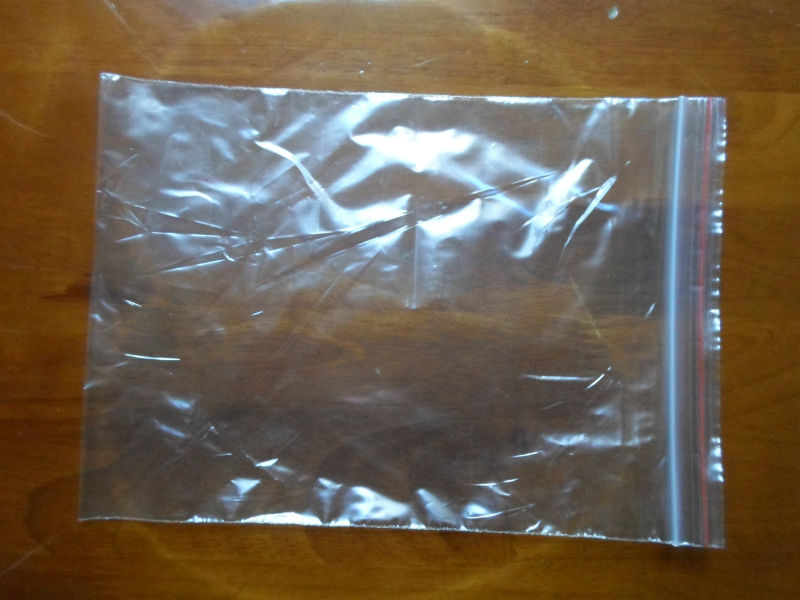Large pe bag with adhesive strip