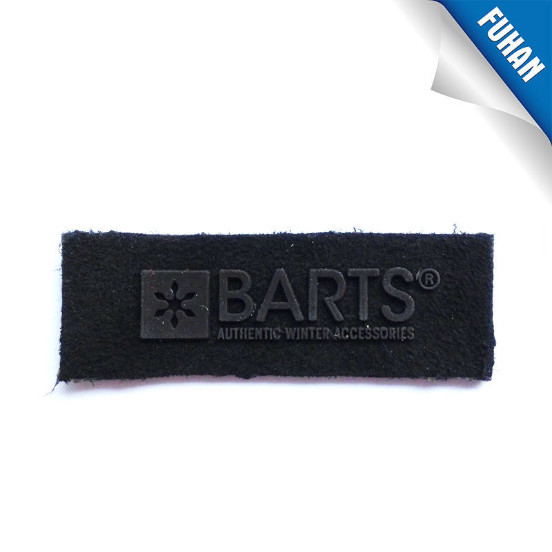 Embossed soft rubber patch