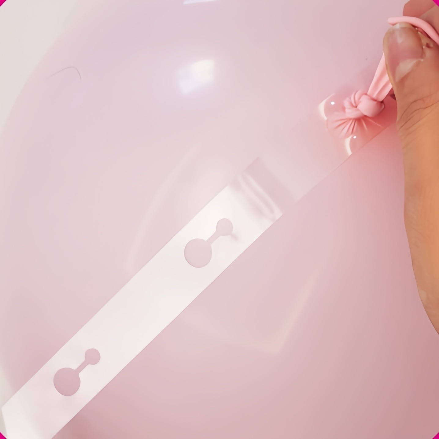 Insert the balloon into the balloon chain again.