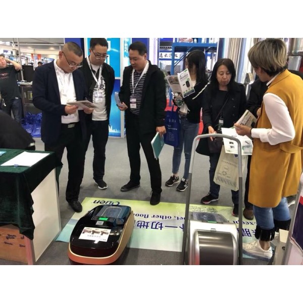 Quen attended the CIPM Expo for Auto thermal shrinable shoe cover dispenser