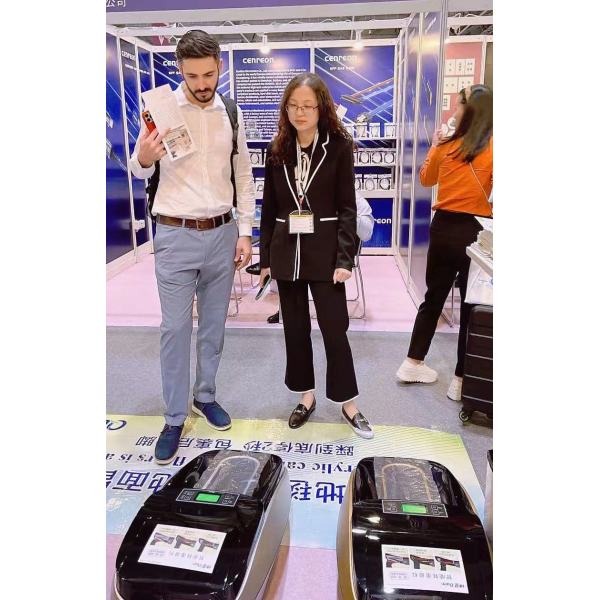 QUEN Automatic shoe cover dispenser was demonstrated at Hong Kong Electronics Exhibition