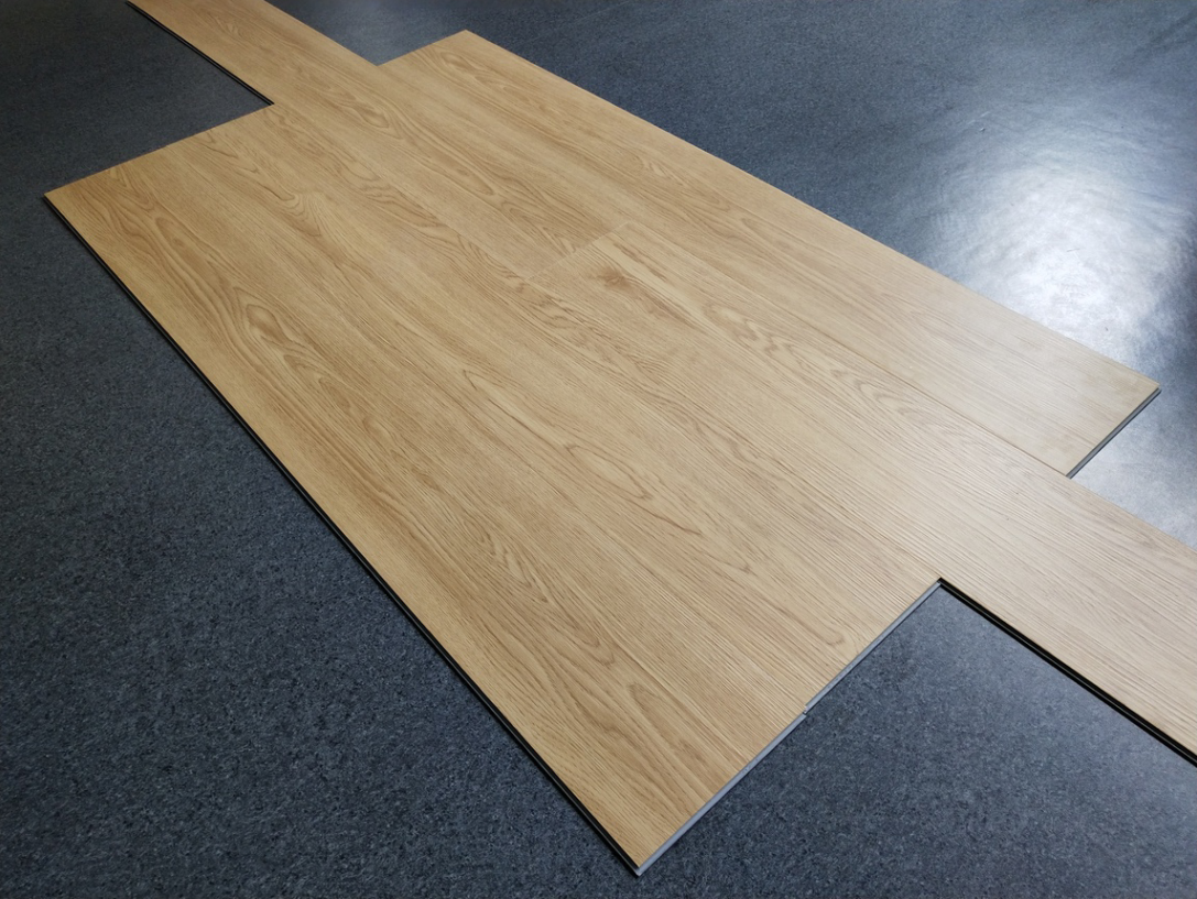 Close-up of luxury vinyl tile LVT flooring with realistic wood grain texture
