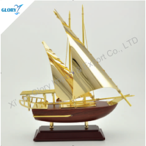 Beautiful Golden Model Sailboat Sails