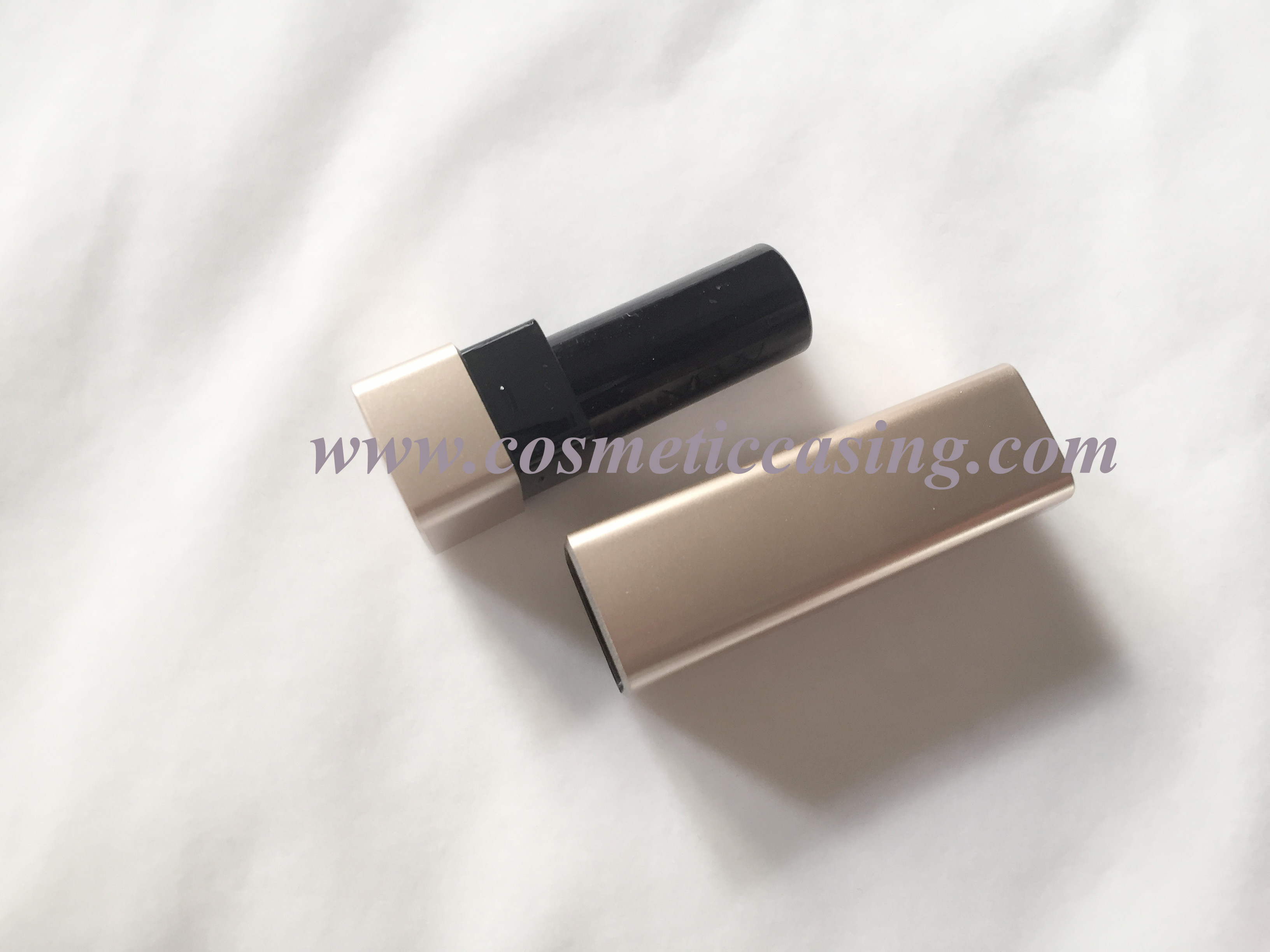 gold empty lipstick container