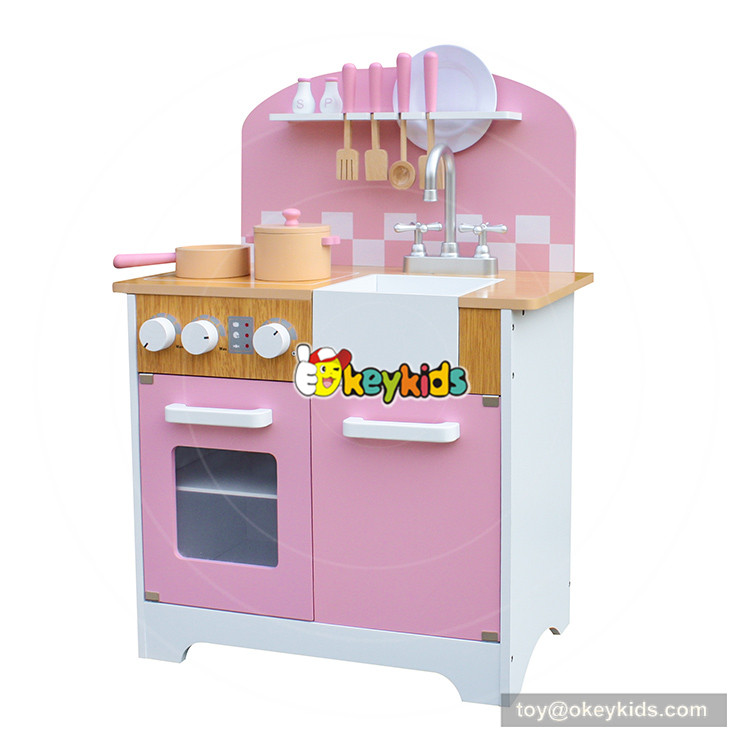 pink wooden toy kitchen