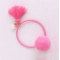 Child pink pom pom ponytail holder with tassels