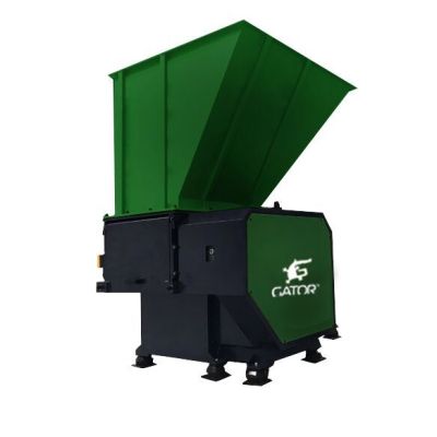 Industrial single shaft shredder machine for recycling applications.