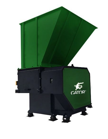 Industrial single shaft shredder machine for recycling applications.