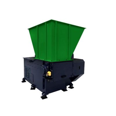 Industrial single shaft shredder machine for recycling applications.